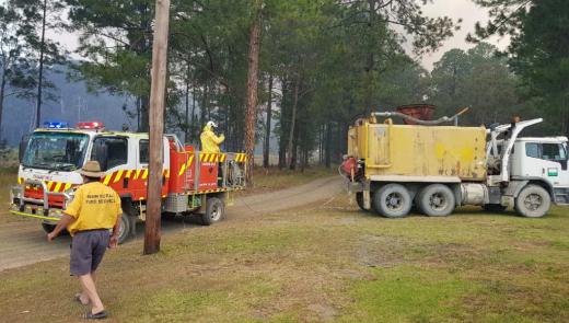 Boral’s water cart delivers water to fire trucks responding to a fire near Johns River township in NSW